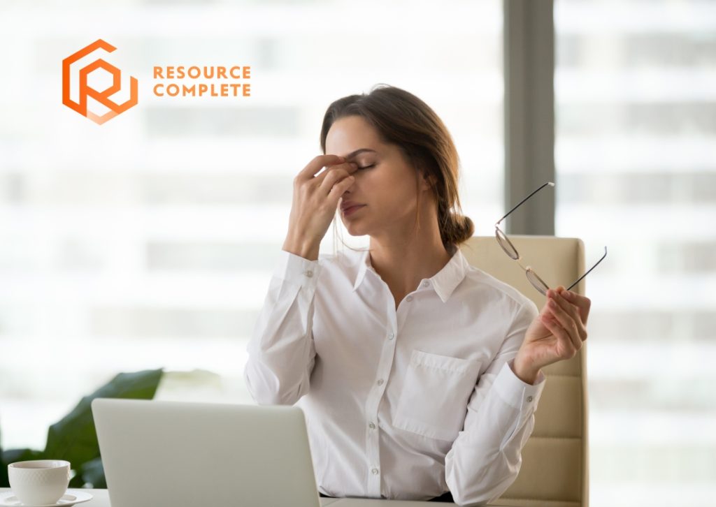 Employee taking a short outdoor break to manage year-end workload and focus