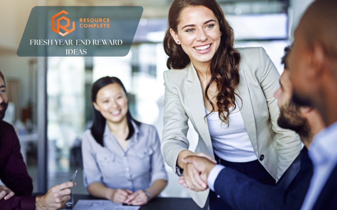 Manager handing a handwritten thank-you note that highlights behaviour, result, and business impact