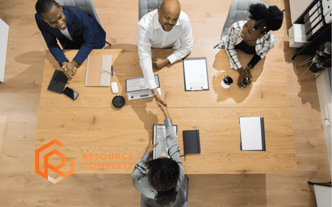 Small business staffing strategy meeting discussing permanent, temporary and outsourced employees